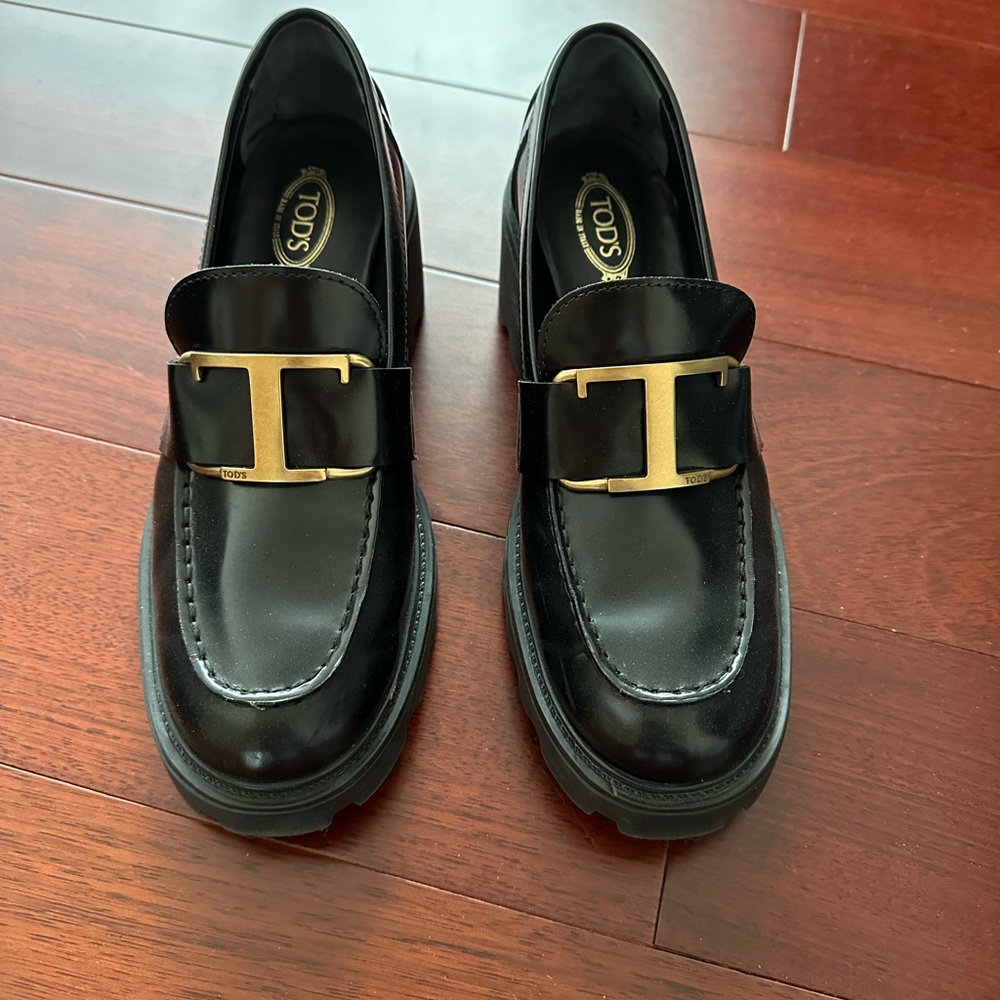 Tod's Black Loafers with Gold Accent